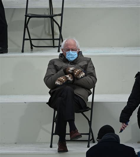 bernie sanders sitting with mittens.